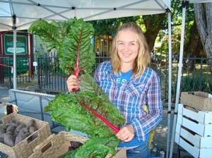 Heather flaunts our chard at the Duncan Farmer's Market.